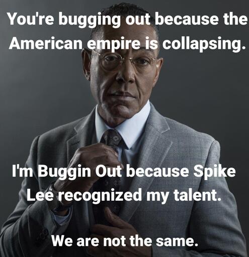 Giancarlo Esposito wearing a suit and looking the viewer in the eye as he straightens his tie. Overlaid on the photo in white text is: You're bugging out because the American Empire is collapsing. I'm Buggin Out because Spike Lee recognized my talent. We are not the same.